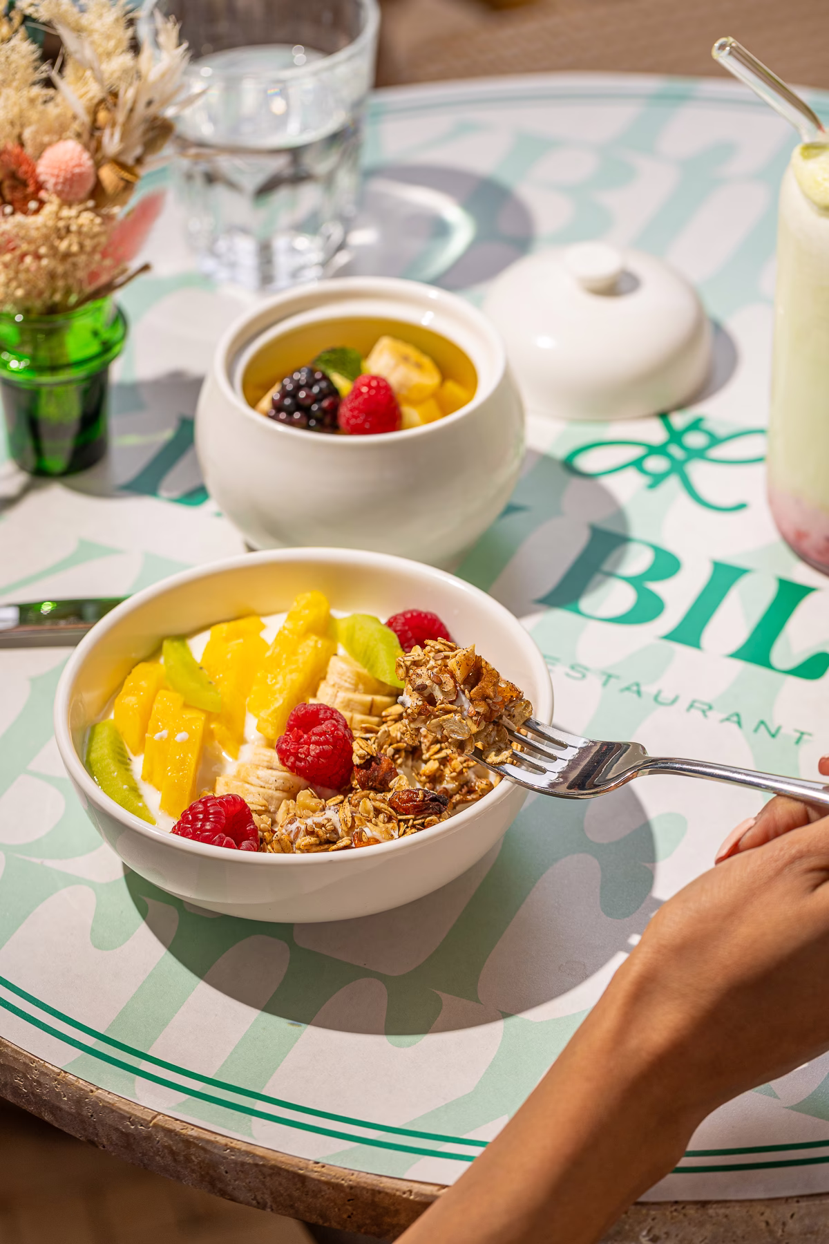 Homemade granola bowl with yoghurt and fresh fruit for breakfast in Marrakech
