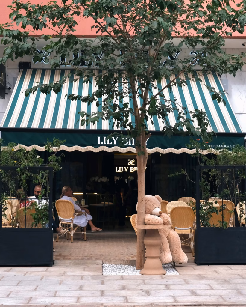 ​The Lily Billy storefront and striped awning from the street in Gueliz